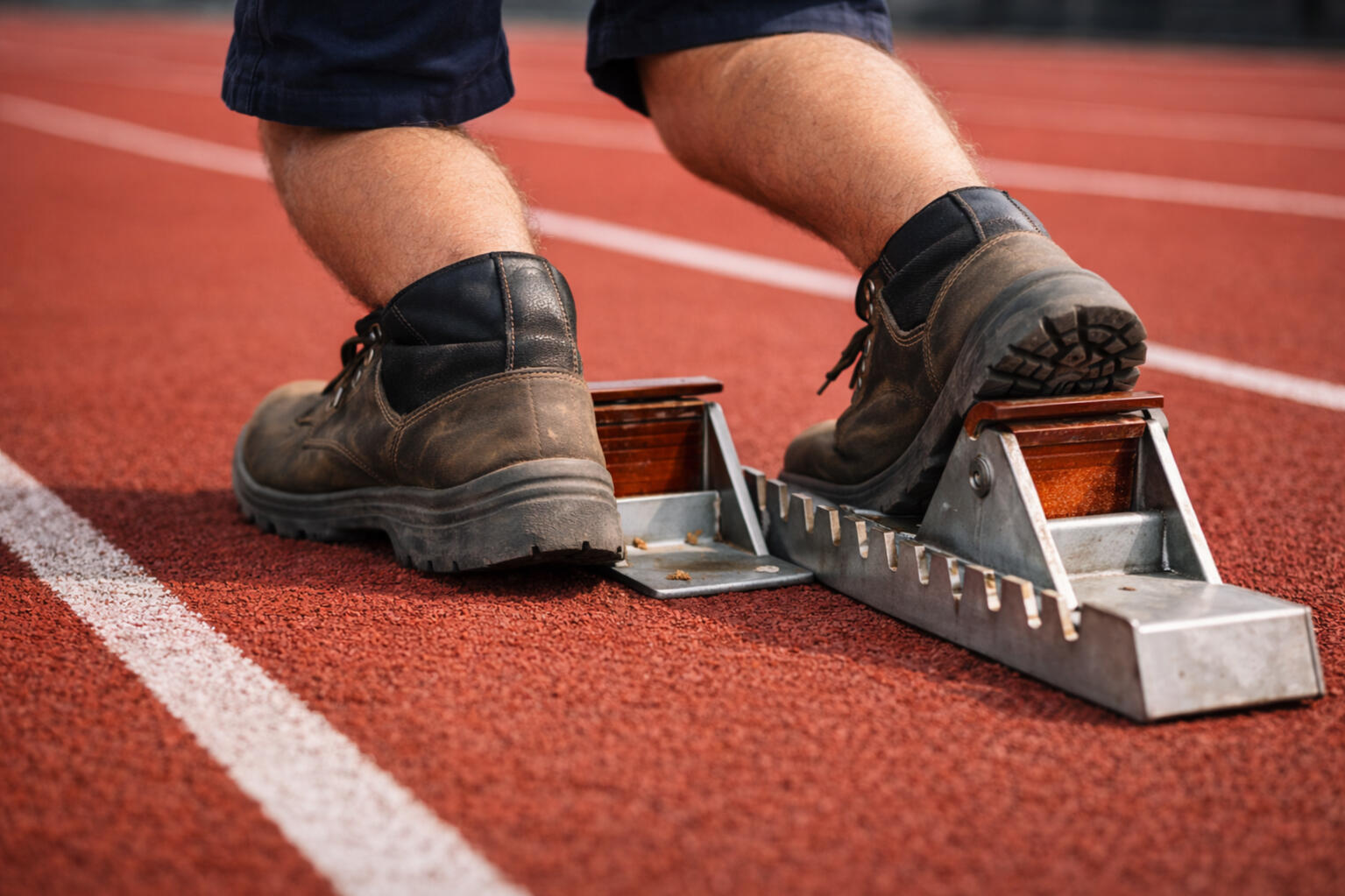 Operational reset sprint to fix one workflow Runner launching from a starting block symbolizing a focused sprint to rebuild a business workflow